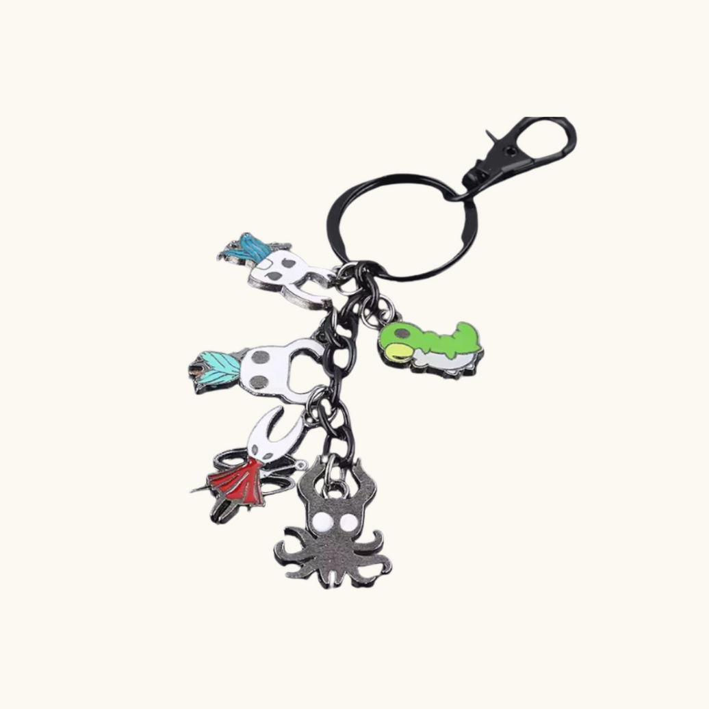 Hollow Knight metal key chain featuring character charm from Pixel Bit, perfect for attaching to keys or backpacks.