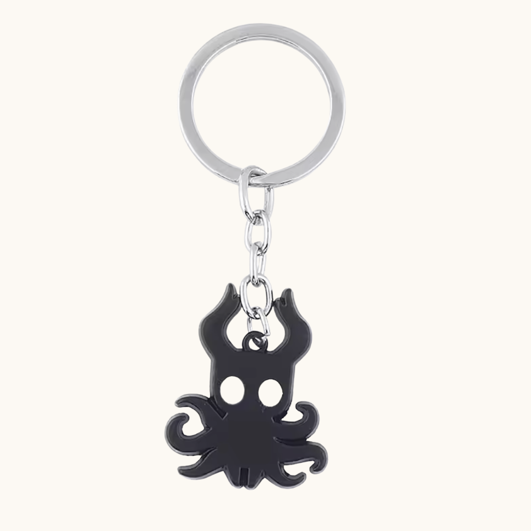 Hollow Knight metal key chain by Pixel Bit featuring a detailed character design, perfect for fans of the Hollow Knight game.