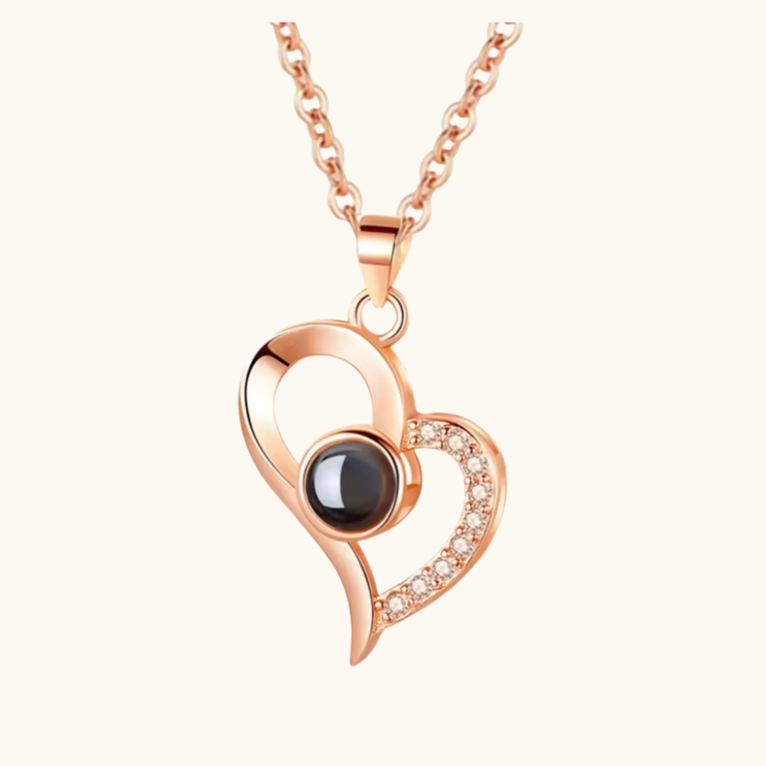Pixel Bit love heart necklace with "I Love You" projection, featuring a romantic heart-shaped pendant on a silver chain.