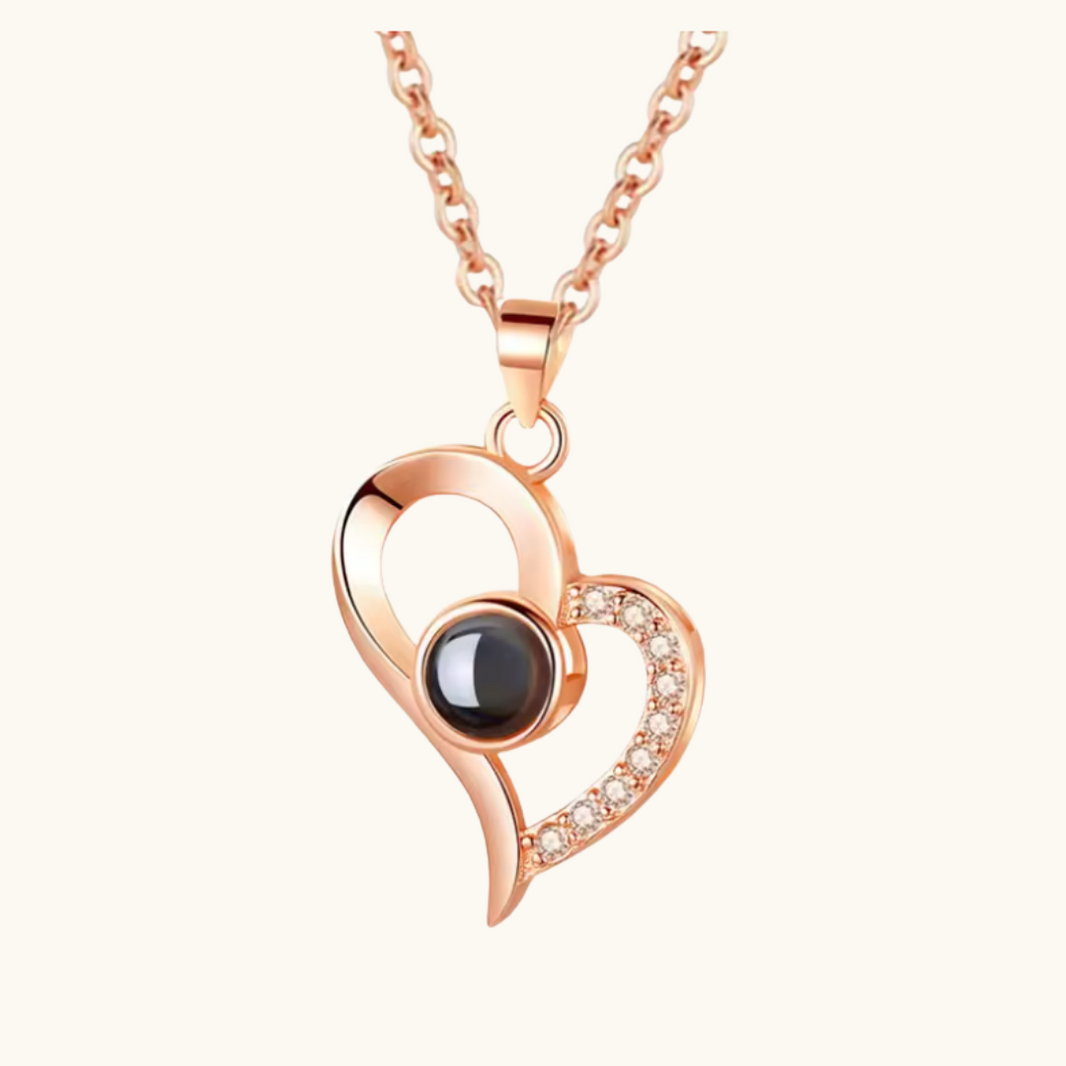 Pixel Bit love heart necklace with "I Love You" projection, featuring a romantic heart-shaped pendant on a silver chain.